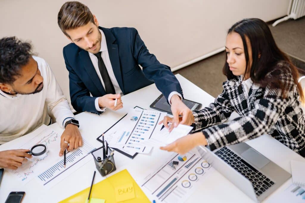 A team reviewing financial charts and planning business improvements